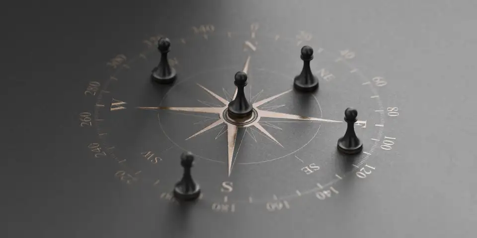 Golden compass rose over black background with five pawns. Business advice or strategic marketing concept.
